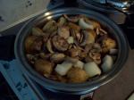 Roast, potatoes, onions, and mushrooms