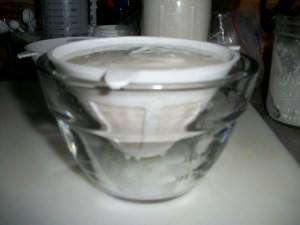 Strain whey from yogurt.